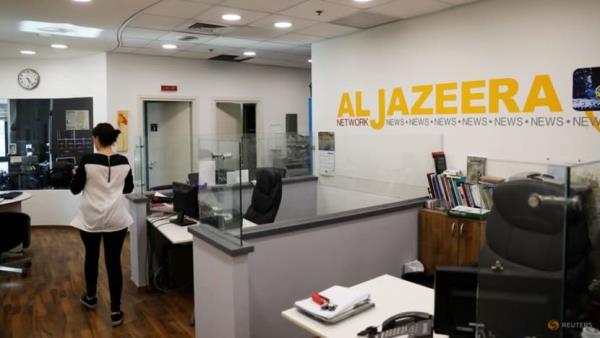 Israel says it is revoking press credentials of Al Jazeera journalists