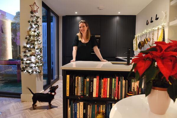 Jennifer Sheahan with Perry: A flat Christmas tree takes up zero floor space. Picture: Moya Nolan Jennifer Sheahan with Perry: A flat Christmas tree takes up zero floor space. Picture: Moya Nolan